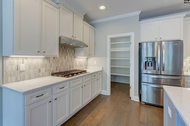 kitchen featuring stainless steel appliances, ornamental molding, white cabinets, and under cabinet range hood