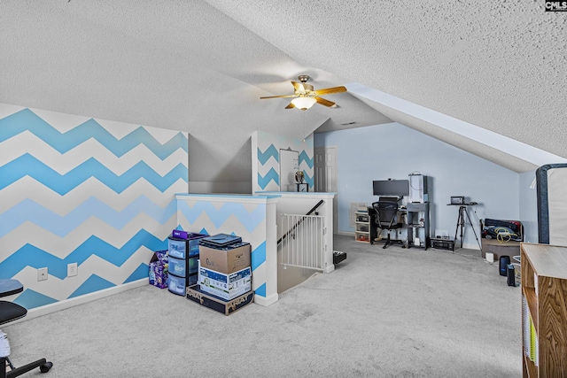 interior space featuring vaulted ceiling, carpet floors, a textured ceiling, and baseboards