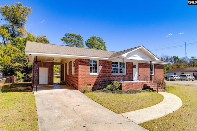 single story home featuring an attached carport, brick siding, driveway, crawl space, and a front lawn