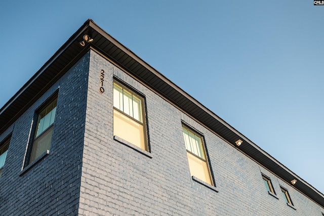 view of home's exterior featuring brick siding