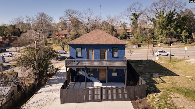 view of front of home with a fenced front yard, a gate, and a front lawn