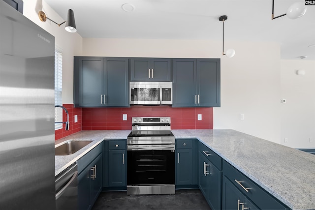 kitchen with stainless steel appliances, tasteful backsplash, a peninsula, and a sink