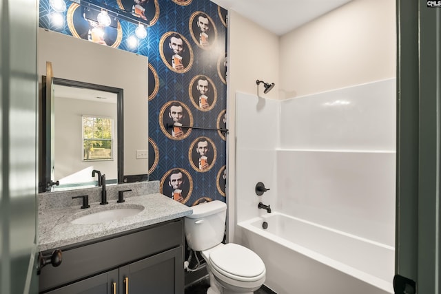 bathroom with shower / bathtub combination, vanity, toilet, and wallpapered walls