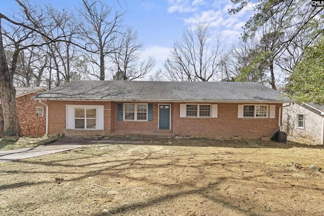 ranch-style house featuring brick siding