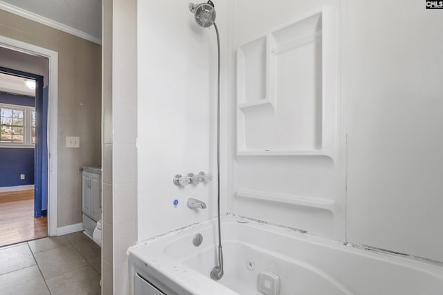 bathroom with a combined bath / shower with jetted tub, ornamental molding, vanity, tile patterned flooring, and baseboards