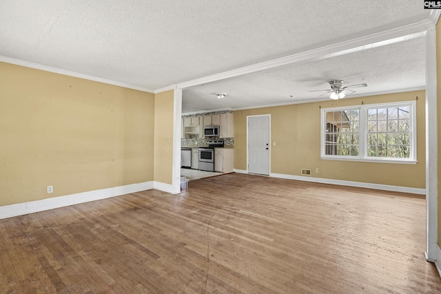 unfurnished living room featuring light wood-type flooring, baseboards, ornamental molding, and ceiling fan