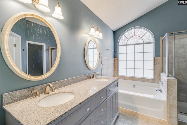 bathroom featuring a stall shower, a sink, lofted ceiling, and tile patterned floors