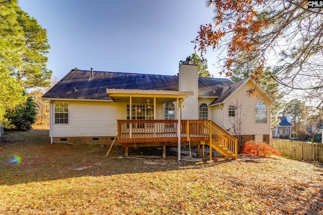 back of property with a chimney, stairway, crawl space, fence, and a wooden deck