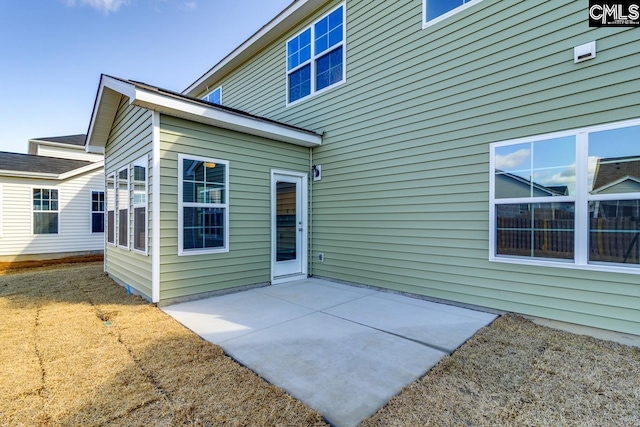 rear view of property featuring a patio area