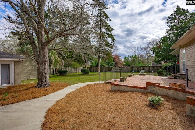 view of yard with a patio and fence