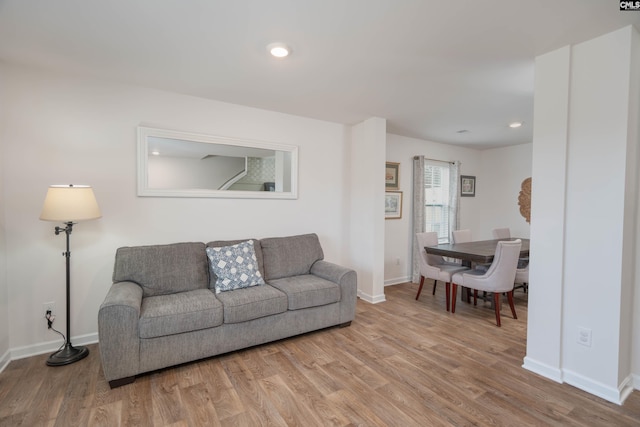 living room featuring baseboards and wood finished floors