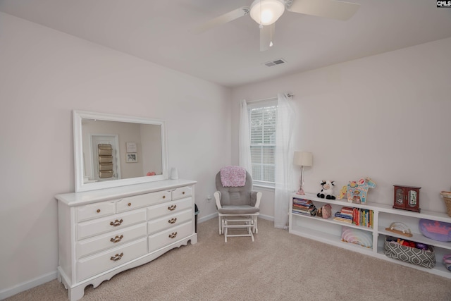 game room featuring baseboards, visible vents, ceiling fan, and light colored carpet