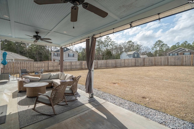 view of patio featuring a fenced backyard and outdoor lounge area