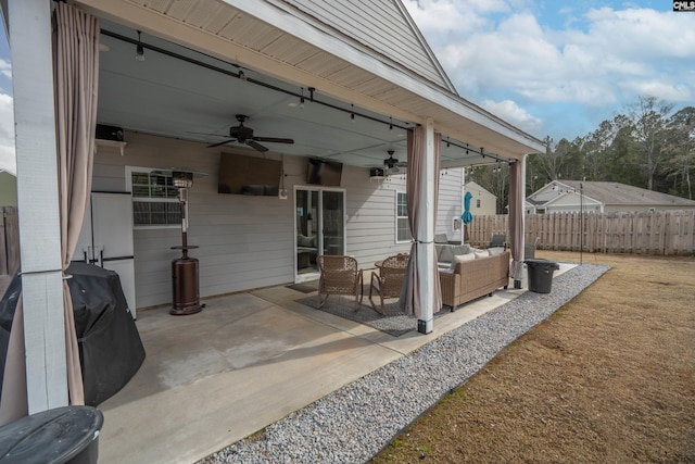 view of patio / terrace featuring ceiling fan, fence, and an outdoor hangout area