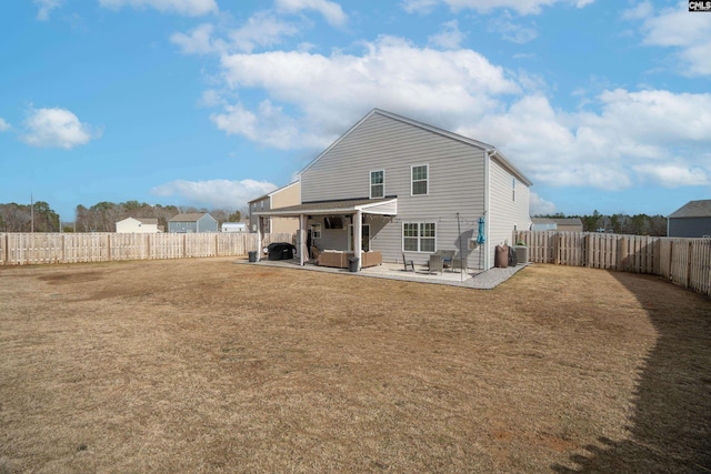 rear view of house featuring an outdoor living space, a patio area, a lawn, and a fenced backyard