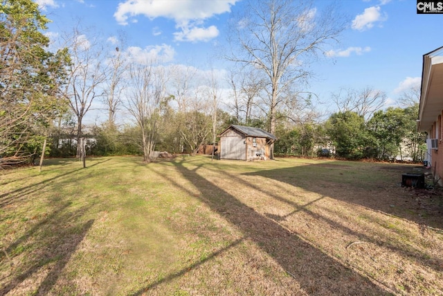 view of yard with an outdoor structure and a shed