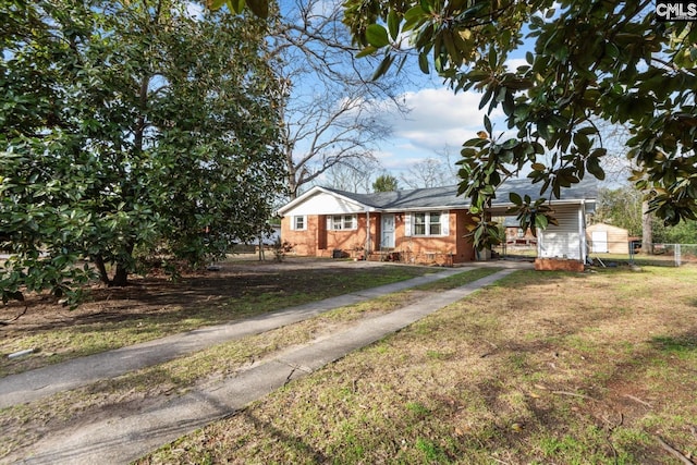 view of front of property with a front lawn and fence