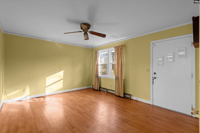 unfurnished room featuring ornamental molding, wood finished floors, a ceiling fan, and baseboards