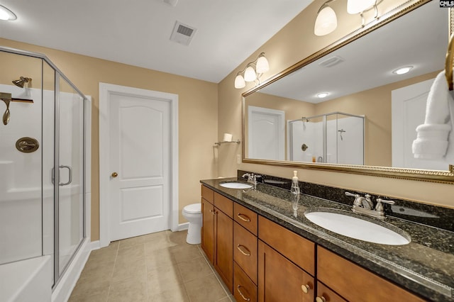 full bathroom featuring a stall shower, tile patterned flooring, visible vents, and a sink