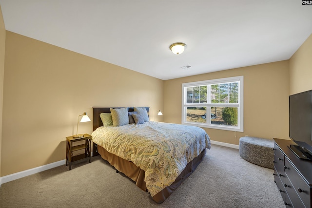 carpeted bedroom with baseboards and visible vents