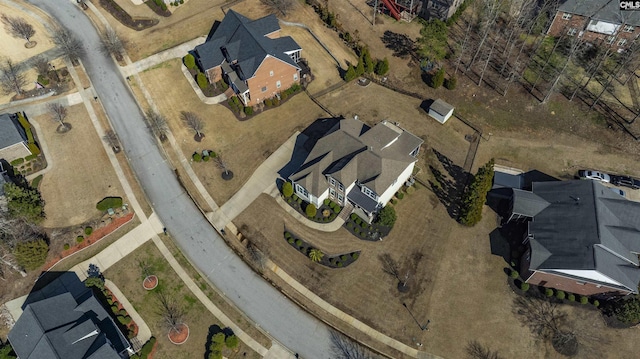 birds eye view of property with a residential view