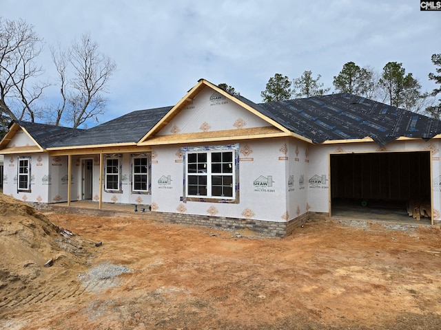 property in mid-construction featuring an attached garage