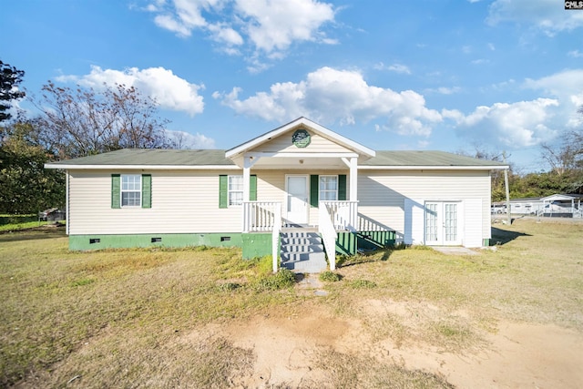 view of front facade featuring a front lawn, crawl space, and french doors