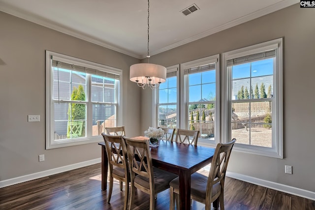 dining space featuring baseboards, dark wood-style flooring, visible vents, and crown molding