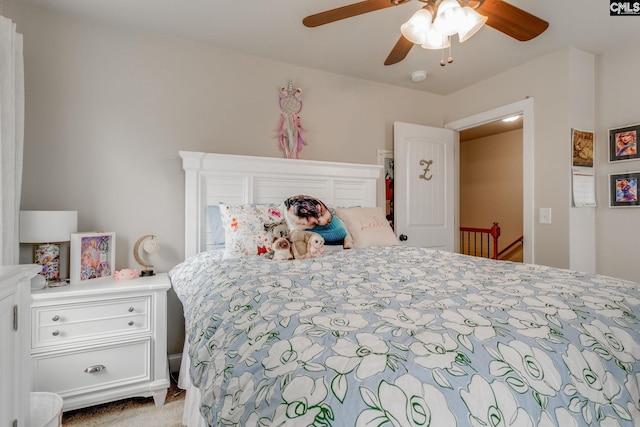 bedroom with ceiling fan and carpet flooring