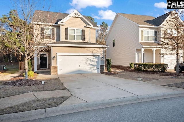 view of front of home with brick siding, driveway, and an attached garage