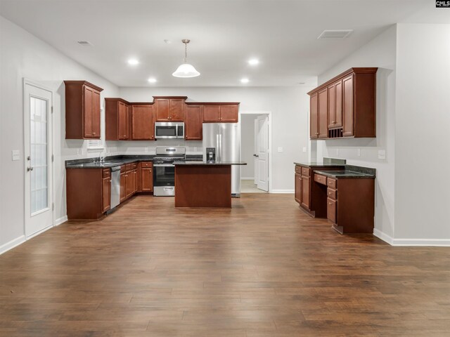 1124 Campbell Ridge Dr, Elgin, SC 29045 - kitchen with dark countertops, stainless steel appliances, dark wood-style flooring, and recessed lighting