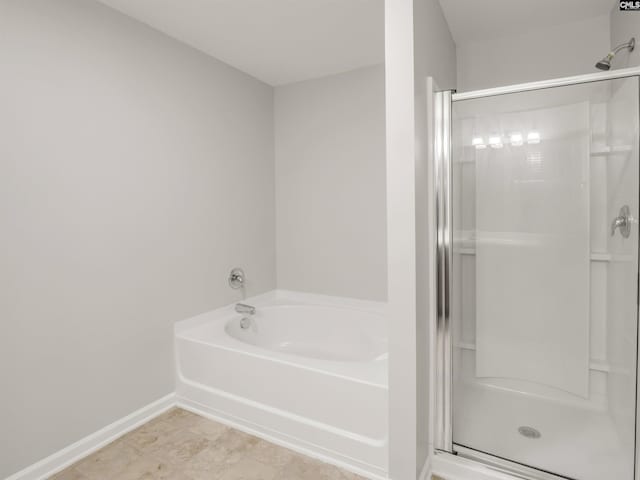 1124 Campbell Ridge Dr, Elgin, SC 29045 - bathroom featuring a shower stall, a bath, and baseboards
