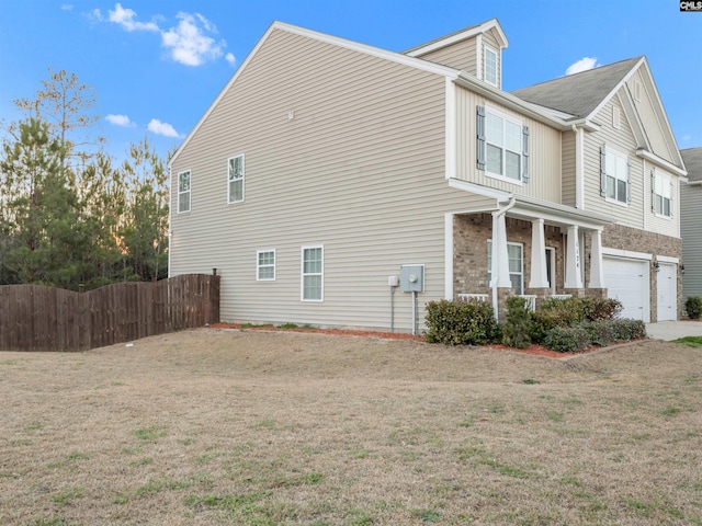 1124 Campbell Ridge Dr, Elgin, SC 29045 - view of side of property featuring a yard, an attached garage, and fence
