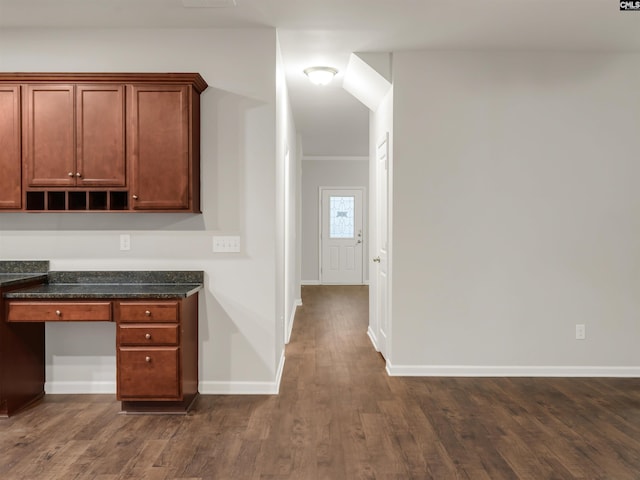 1124 Campbell Ridge Dr, Elgin, SC 29045 - interior space featuring dark wood-style flooring, built in desk, ornamental molding, dark stone countertops, and baseboards