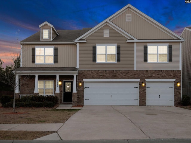 1124 Campbell Ridge Dr, Elgin, SC 29045 - view of front of property with a garage, concrete driveway, brick siding, and covered porch