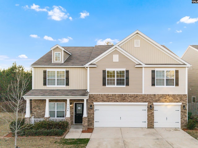 1124 Campbell Ridge Dr, Elgin, SC 29045 - view of front of house with driveway, an attached garage, covered porch, board and batten siding, and brick siding