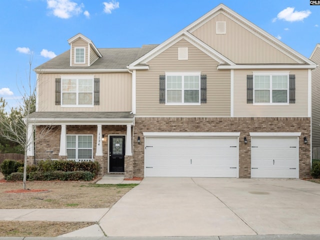 1124 Campbell Ridge Dr, Elgin, SC 29045 - view of front of house featuring driveway, brick siding, and an attached garage