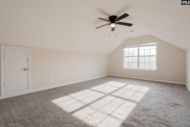 bonus room featuring carpet floors, visible vents, vaulted ceiling, ceiling fan, and baseboards