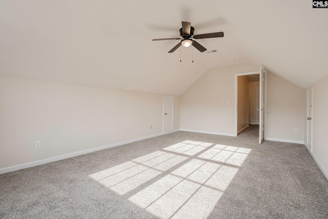 bonus room with visible vents, baseboards, light colored carpet, lofted ceiling, and ceiling fan