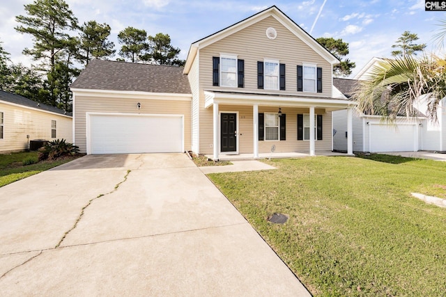 traditional-style home with an attached garage, cooling unit, covered porch, concrete driveway, and a front yard