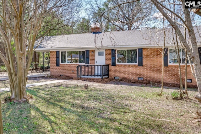 ranch-style house featuring crawl space, a chimney, a front lawn, and brick siding