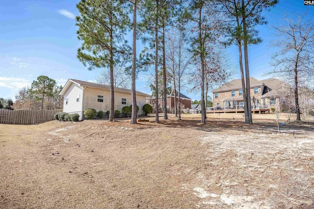 rear view of property with fence