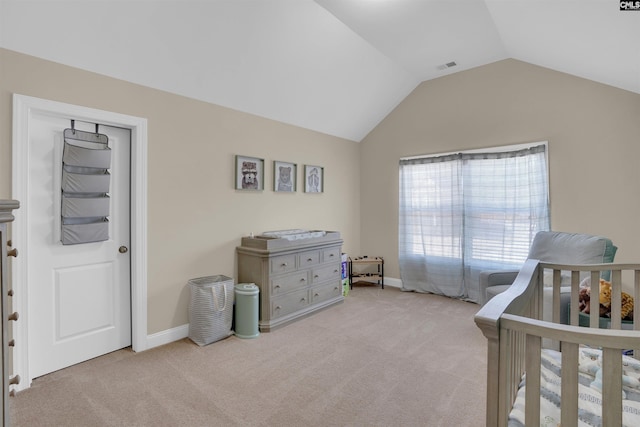 bedroom featuring baseboards, visible vents, vaulted ceiling, and light colored carpet