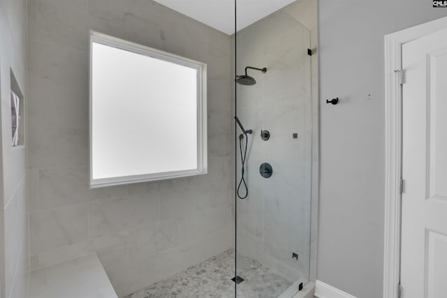 full bathroom with tiled shower