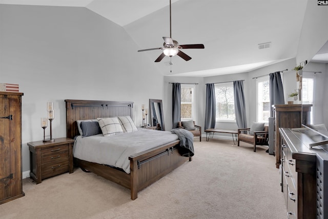 bedroom featuring visible vents, baseboards, light colored carpet, ceiling fan, and high vaulted ceiling