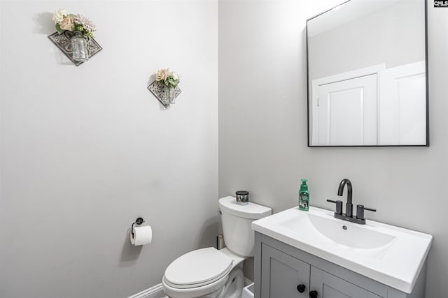 half bath with toilet and vanity