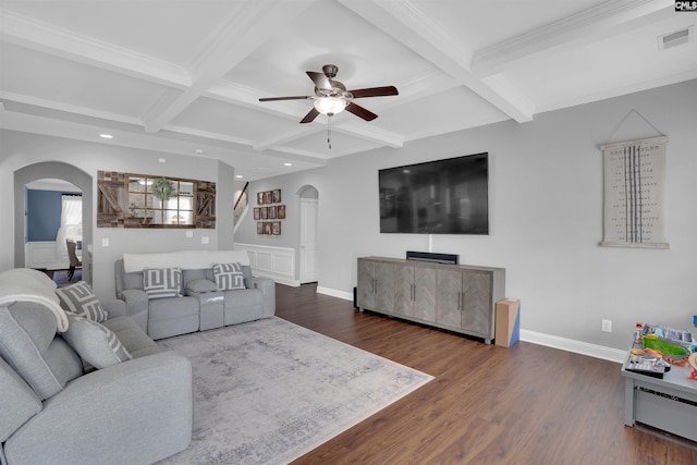 living room featuring arched walkways, dark wood-style flooring, visible vents, and baseboards