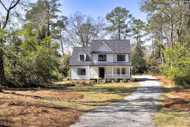 modern inspired farmhouse featuring covered porch, crawl space, and gravel driveway