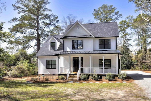 modern inspired farmhouse with driveway, metal roof, crawl space, a porch, and a front yard