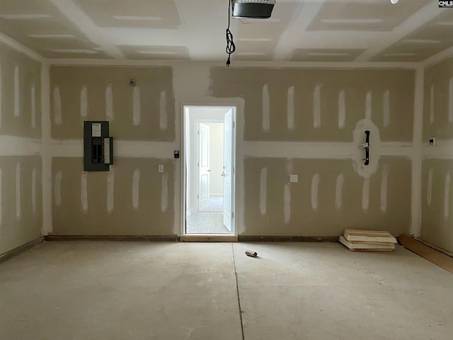 garage featuring electric panel and a garage door opener
